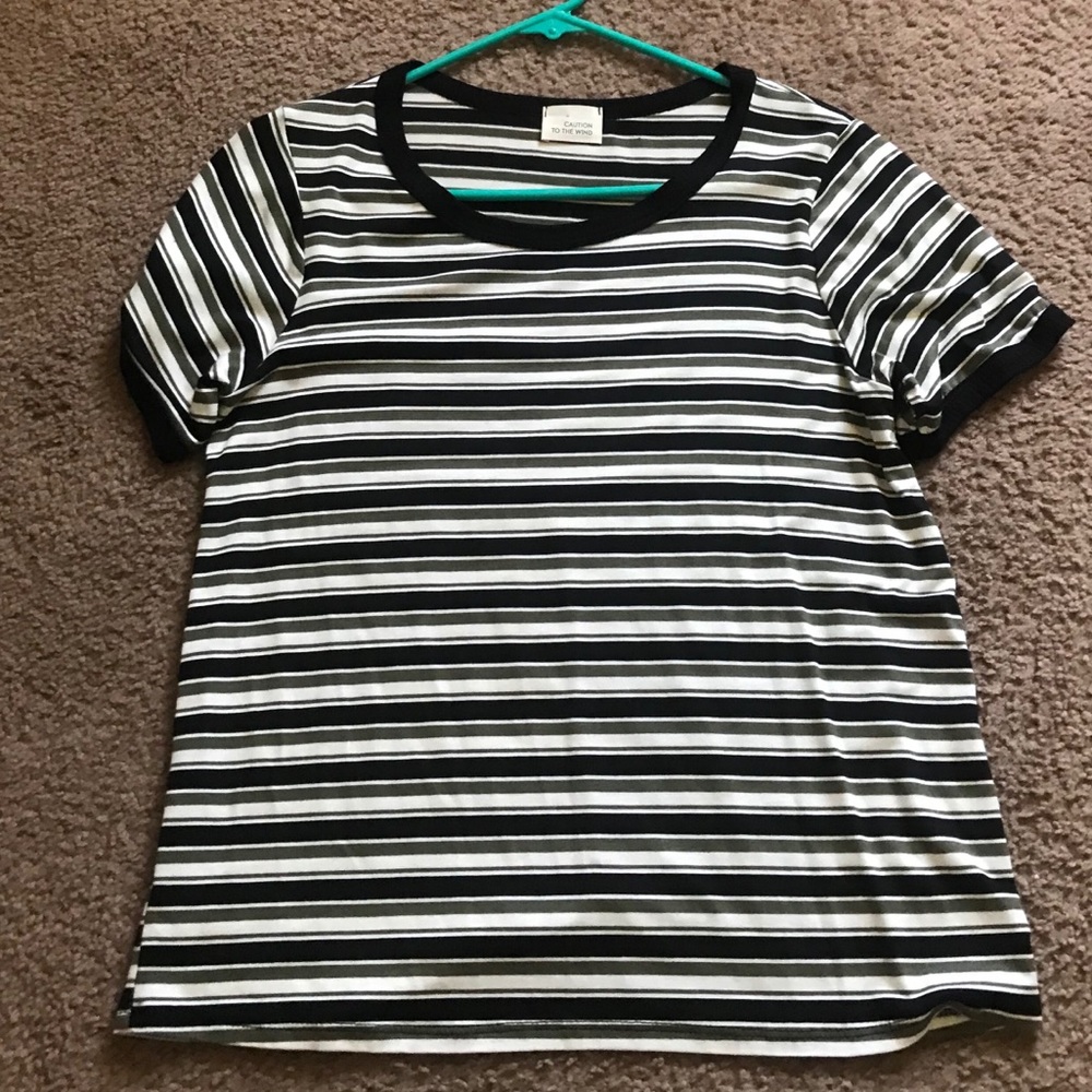 Marshall’s black, green, and white striped shirt